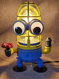 Steampunk style MINION Lamp made with black iron pipe and Vandal proof security light