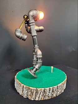 Steampunk style Golfer golf player Guy lamp made with black iron pipe, brass Plated Pipe with a tree slice base