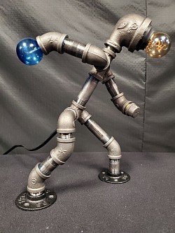 Steampunk style BOWLING bowler Guy lamp made with black iron pipe and a ball that lights up
