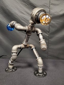 Steampunk style BOWLING bowler Guy lamp made with black iron pipe and a ball that lights up